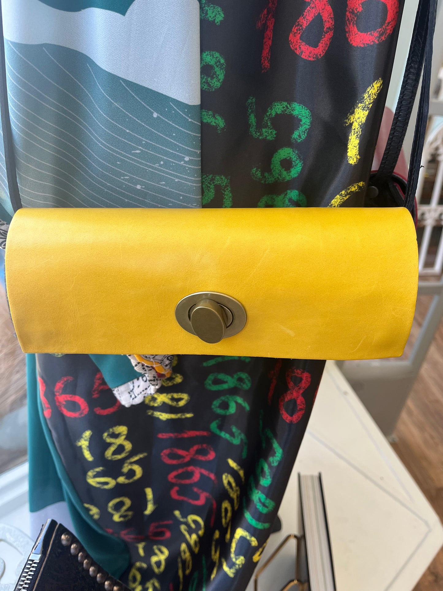 Cylindrical Clasp Crossbody Bag
